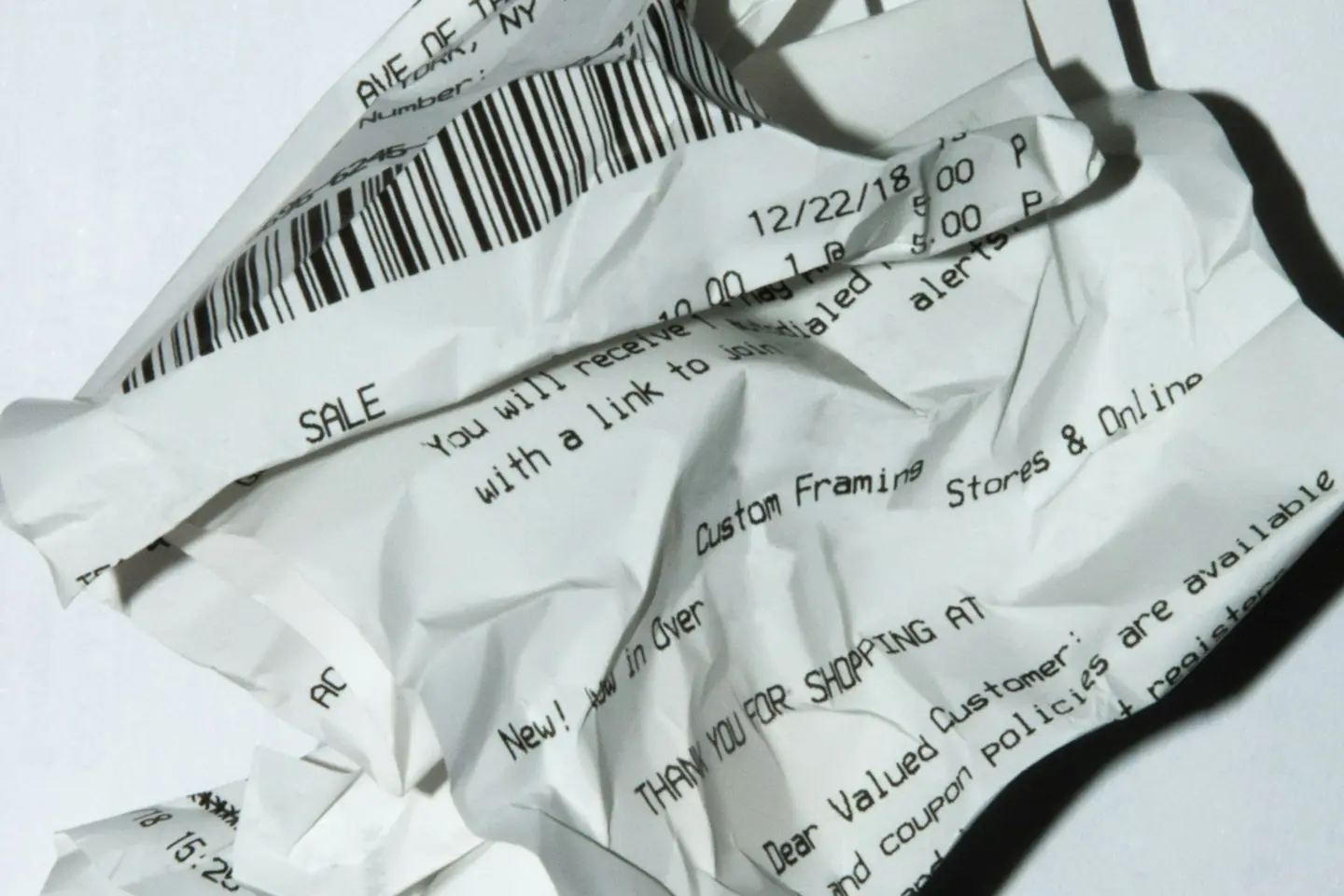 Printed store receipts spread across a desk